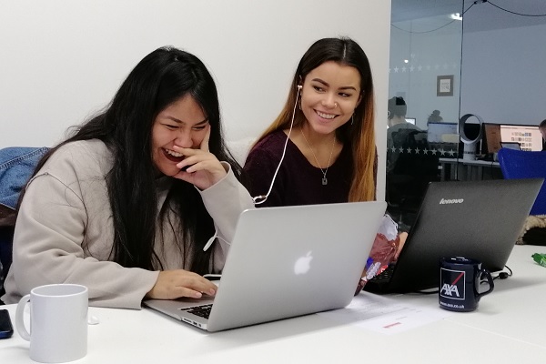 Sheyla Flores and Tammie Smith working at Placement Year International 