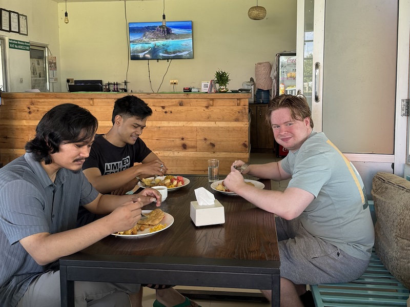 Ben Martin having lunch with 2 Nepalese work colleagues in Kathmandu