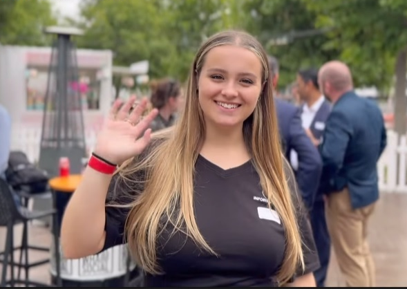 Intern in Australia waving to the camera while on placement